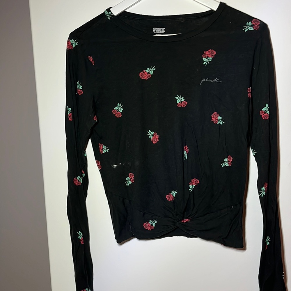 The brand is H&M it is a comfy shirt black long sleeve with floral Patterns